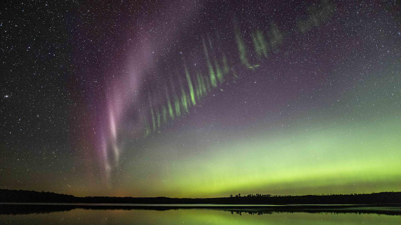 Taken July 17, 2018, at Little Kenosee Lake, Saskatchewan, Canada, this photo shows the tiny green streaks below STEVE. Neil Zeller, photographer and co-author on the paper, commented "STEVE was bright and powerful for a full hour that night." CREDIT: Copyright Neil Zeller, used with permission