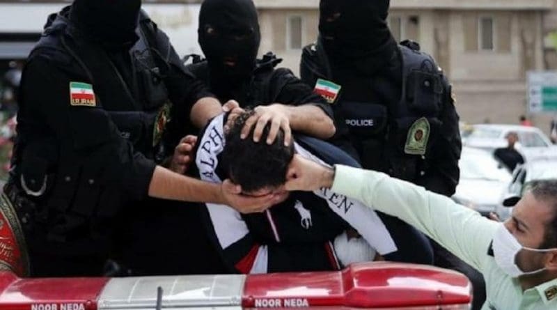 Iranian security forces detain a protestor. Photo Credit: Iran News Wire