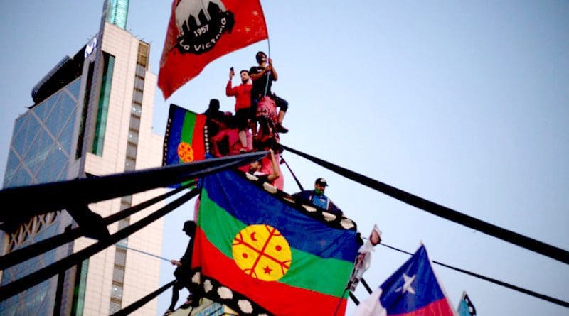 Mapuche flag, representing the original Native people of Chile and Argentina, that demand constitutional recognition, land recovery, and the end of Chilean State harassment. Photo Credit: Pressenza News Agency