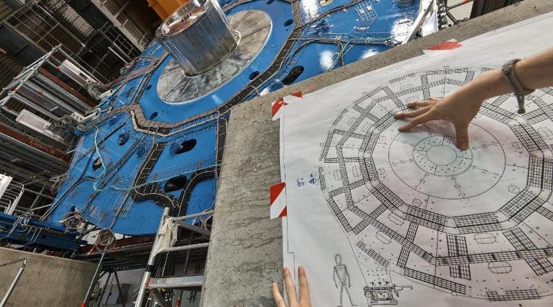 A wheel-shaped muon detector is part of an ATLAS particle detector upgrade at CERN. A new study applies "unfolding," or error-correction techniques used for particle detectors, to problems with noise in quantum computing. CREDIT: Julien Marius Ordan/CERN