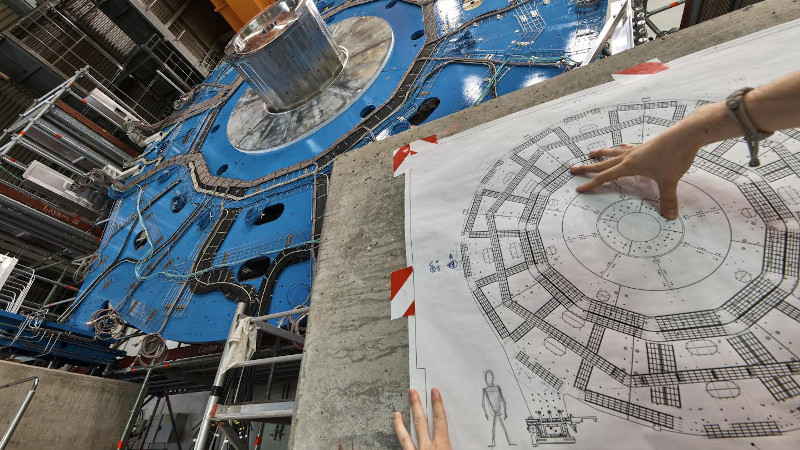 A wheel-shaped muon detector is part of an ATLAS particle detector upgrade at CERN. A new study applies "unfolding," or error-correction techniques used for particle detectors, to problems with noise in quantum computing. CREDIT: Julien Marius Ordan/CERN
