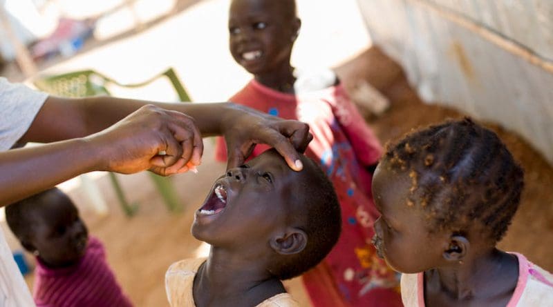 A child receiving polio vaccine. Copyright: UN Photo/JC McIlwaine, CC BY-NC-ND 2.0