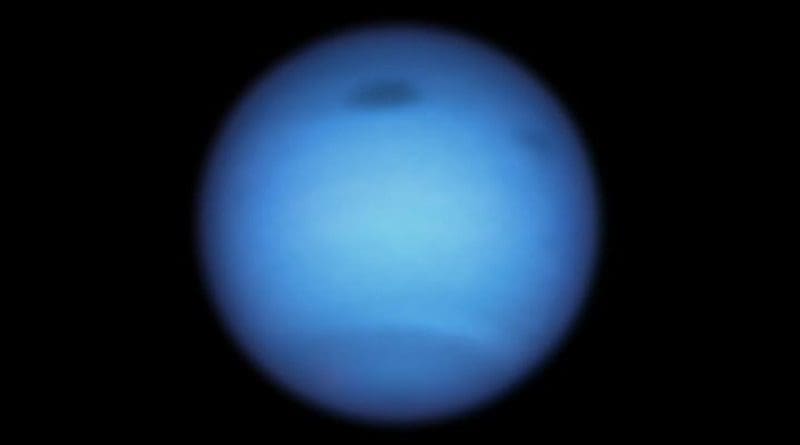 This Hubble Space Telescope snapshot of the dynamic blue-green planet Neptune reveals a monstrous dark storm (top center) and the emergence of a smaller dark spot nearby (top right). The giant vortex, which is wider than the Atlantic Ocean, was traveling south toward certain doom by atmospheric forces at the equator when it suddenly made a U-turn and began drifting back northward. CREDIT: NASA, ESA, STScI, M.H. Wong (University of California, Berkeley), and L.A. Sromovsky and P.M. Fry (University of Wisconsin-Madison)