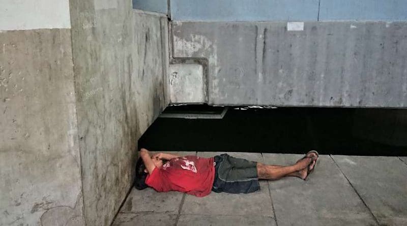 A homeless man sleeps under a bridge in Bangkok, Thailand. Photo: UCA News