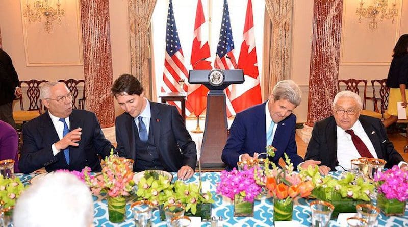 From left to right, former U.S. Secretary of State Colin Powell, Canadian Prime Minister Justin Trudeau, U.S. Secretary of State John Kerry, and former U.S. Secretary of State Henry Kissinger chat at the State Luncheon in honour of the Prime Minister at the U.S. Department of State in Washington, D.C., on March 10, 2016. [State Department photo/ Public Domain]