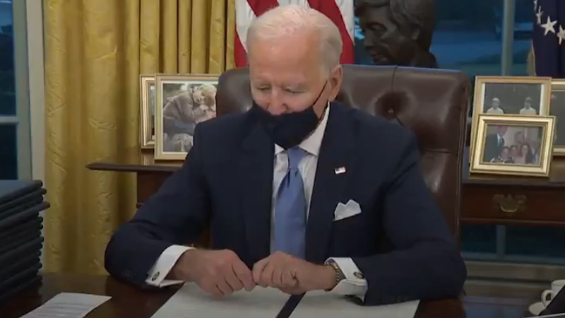 US President Joe Biden signing executive orders. Photo Credit: White House video screenshot