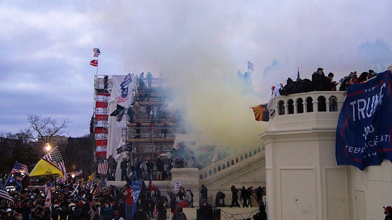 Tear gas outside the United States Capitol on January 6, 2021 as mob storms the building. Photo Credit: Tyler Merbler, Wikimedia Commons