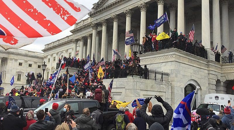 Trump supporters crowding the steps of the Capitol in Washington DC after displacing police shield wall preventing access. Photo Credit: TapTheForwardAssist, Wikipedia Commons