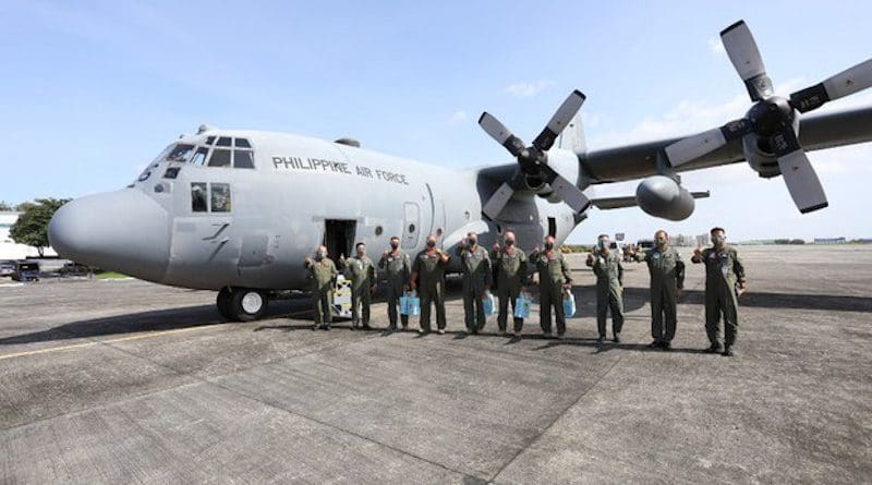 Members of the Philippine Air Force receive a C-130H plane acquired from the U.S. government, Jan. 29, 2021. Handout Philippine Air Force