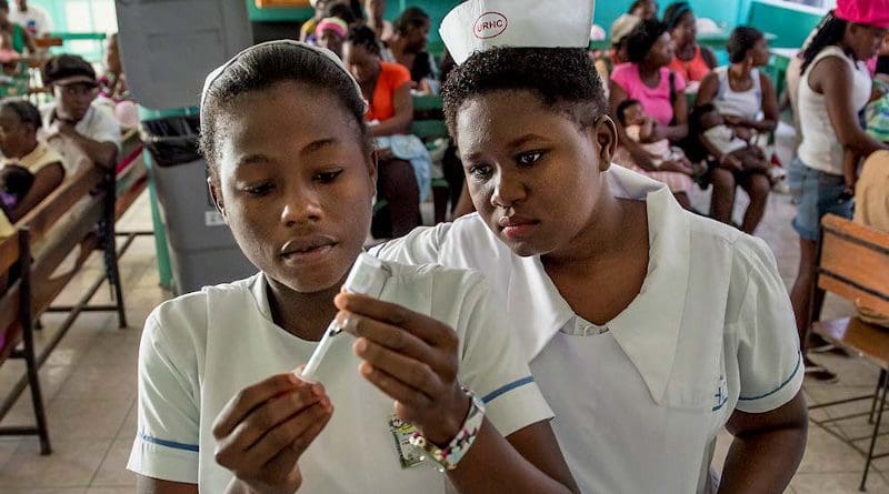Student nurses in Haiti prepare to administer a vaccine. Open vaccine science campaigns must be delivered urgently to address hesitancy and misinformation around COVID-19 vaccines, an expert panel heard. Copyright: Karen Kasmauski, MCSP and Jhpiego, (CC BY-NC 2.0)