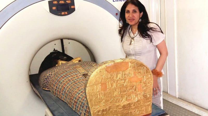 Dr Sahar Saleem placing the mummy in the CT scanner CREDIT Sahar Saleem
