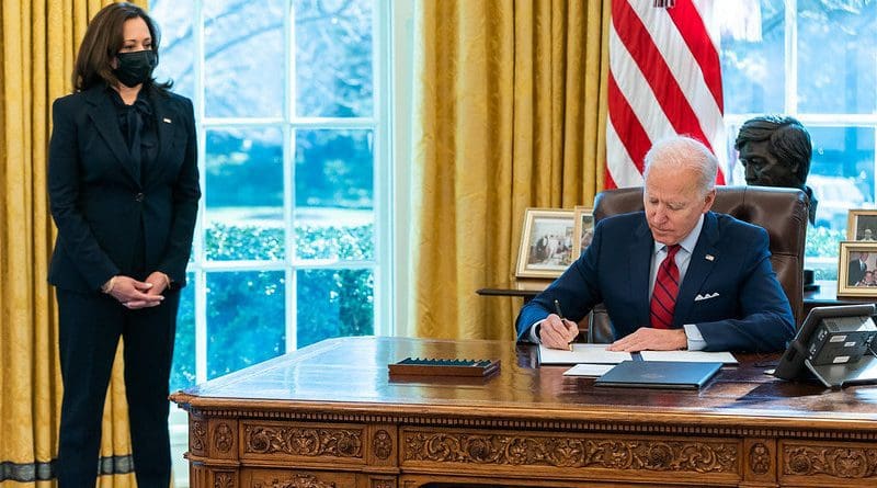 President Joe Biden, joined by Vice President Kamala Harris, signs executive orders. (Official White House Photo by Adam Schultz)