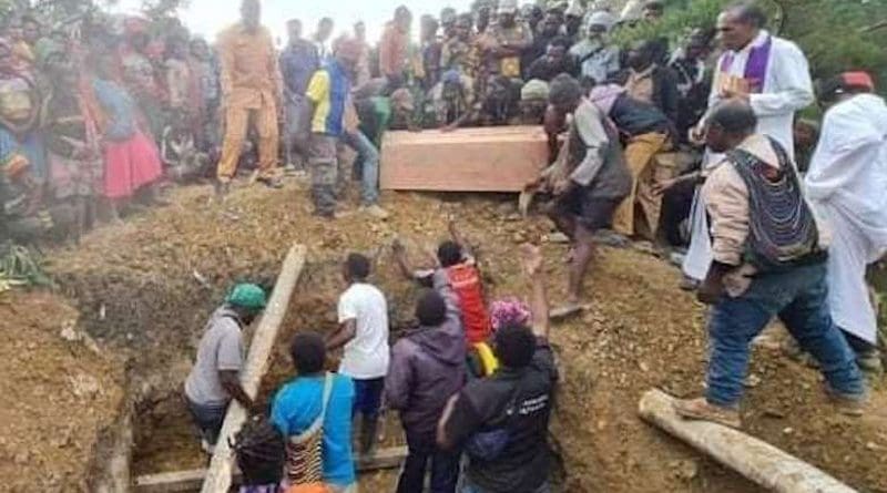 Janius Bagau, Soni Bagau and Justinus Bagau are buried in Bilogai village on Feb. 16. The three Papuans were beaten to death by Indonesian soldiers at a clinic where Janius was seeking medical aid. (Photo supplied)