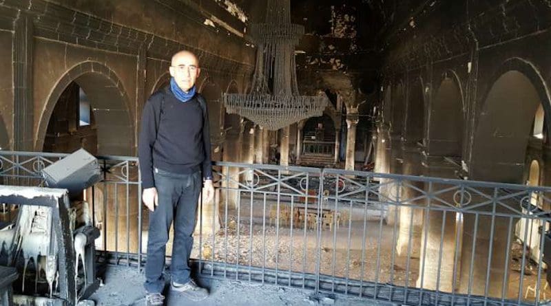 Fr. Georges Jahola in Al-Tahira church in Bakhdida in November 2016, shortly after the town's liberation. Photo courtesy of Fr. Jahola.