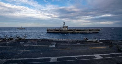 The Theodore Roosevelt Carrier Strike Group transits in formation with the Nimitz Carrier Strike Group in the South China Sea Feb. 9, 2021. Photo Credit: Seaman Deirdre Marsac