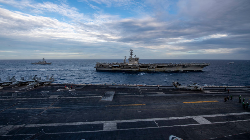 The Theodore Roosevelt Carrier Strike Group transits in formation with the Nimitz Carrier Strike Group in the South China Sea Feb. 9, 2021. Photo Credit: Seaman Deirdre Marsac