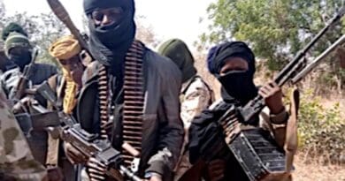Members of a "bandit" gang pose with weapons at their forest hideout in northwestern Zamfara state, Nigeria. Photo Credit: VOA