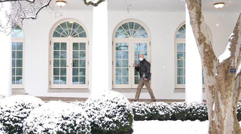 US President Joe Biden walks in the snow at the White House. Photo Credit: White House