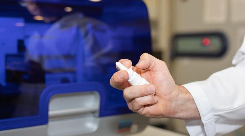 Associate Professor Nathan Bartlett holds a mockup of the immune boosting nasal spray in the HMRI labs in Newcastle, Australia. CREDIT Hunter Medical Research Institute