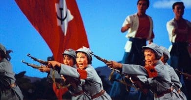 A scene from The Red Detachment of Women opera, adopted from the earlier 1961 film of the same title. Soldiers of the Women's Detachment performing rifle drill in Act II, from the 1972 National Ballet of China production. Source: Wikimedia Commons.
