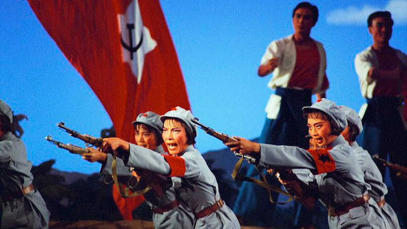 A scene from The Red Detachment of Women opera, adopted from the earlier 1961 film of the same title. Soldiers of the Women's Detachment performing rifle drill in Act II, from the 1972 National Ballet of China production. Source: Wikimedia Commons.