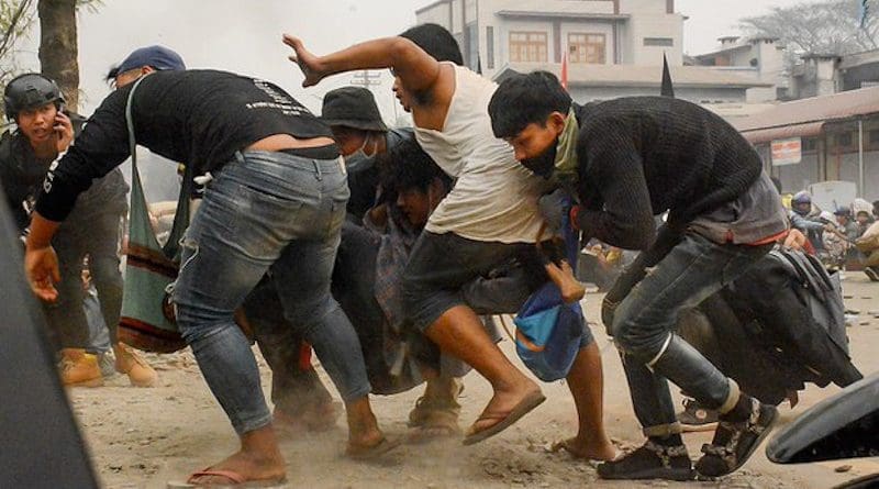 Protesters carrying an injured person in Kalay, in Myanmar's northwestern Sagaing region, March 28, 2021. Photo Credit: Khonumthung/RFA