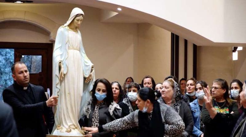 A Marian statue is returned to St. Adday church in Karemlesh, Iraq, March 19, 2021. Photo courtesy Fr. Thabet Habeb.