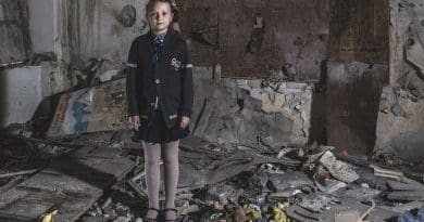 Masha Khromchenko stands in the kindergarten classroom that took a direct hit from a shell in the Luhansk region, Ukraine. Credit: UNICEF/Christopher Morris