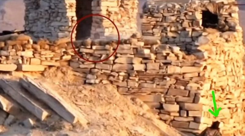 Video grab of BLA video showing BLA fighter [ indicated by green arrow] coming precariously to Pakistani soldier firing a rifle [ encircled in red]. Courtesy YouTube