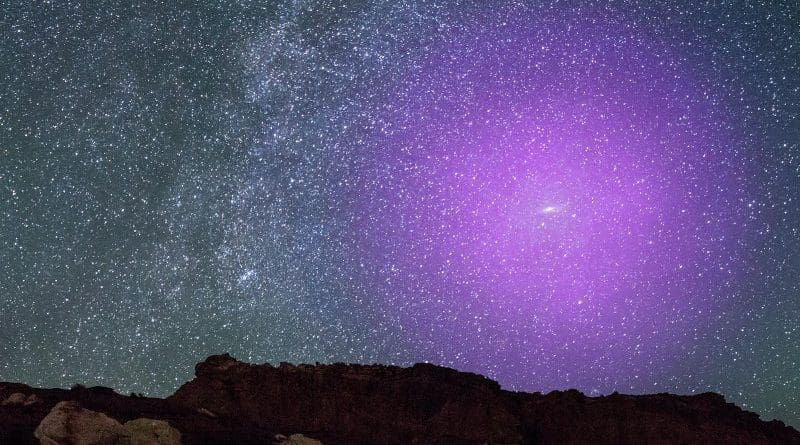 A new study has found that a share of particles that has been challenging to locate is most likely sprinkled across the distant bounds of galaxy halos. The study found some of these particles of baryonic matter are located up to 6 million light-years from their galactic centers. This color-rendered image shows the halo of the Andromeda galaxy, which is the Milky Way's largest galactic neighbor. CREDIT NASA