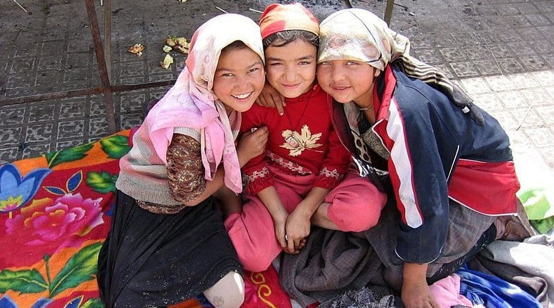 Three Uyghur girls at a Sunday market in the oasis city Khotan. Photo Credit: Colegota, Wikipedia Commons