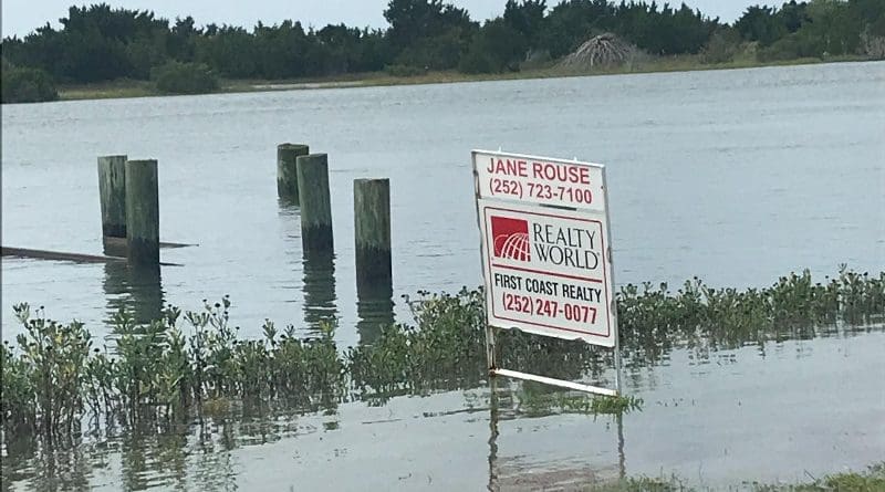 A real estate sign on flooded land in Carteret County, North Carolina. CREDIT Miyuki Hino