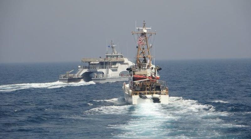 Iran’s Islamic Revolutionary Guard Corps Navy (IRGCN) Harth 55, left, conducted an unsafe and unprofessional action by crossing the bow of the Coast Guard patrol boat USCGC Monomoy (WPB 1326), right, as the U.S. vessel was conducting a routine maritime security patrol in international waters of the southern Arabian Gulf, April 2, 2021. Photo Credit: US Navy