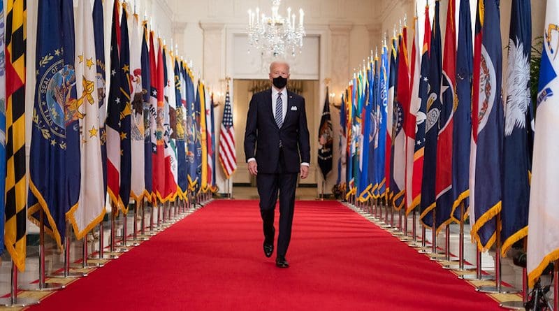 US President Joe Biden walks in the State Dining Room of the White House. (Official White House Photo by Adam Schultz)