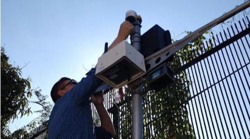 Study author Dan Westervelt sets up an air-quality monitor in Kinshasa, capital of the Democratic Republic of the Congo. CREDIT Courtesy Dan Westervelt