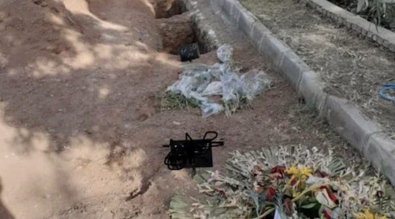 Several photos such as this one of the purported new graves at Khavaran, including two that had signs and flowers laid on them, have been posted online. Credit: Social Media