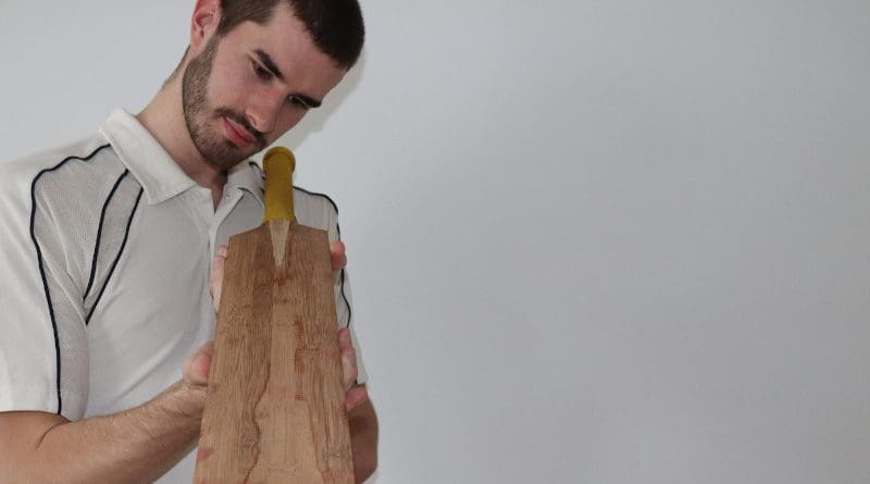 Co-author Ben Tinkler-Davies examines a prototype bamboo cricket bat CREDIT Ben Tinkler-Davies