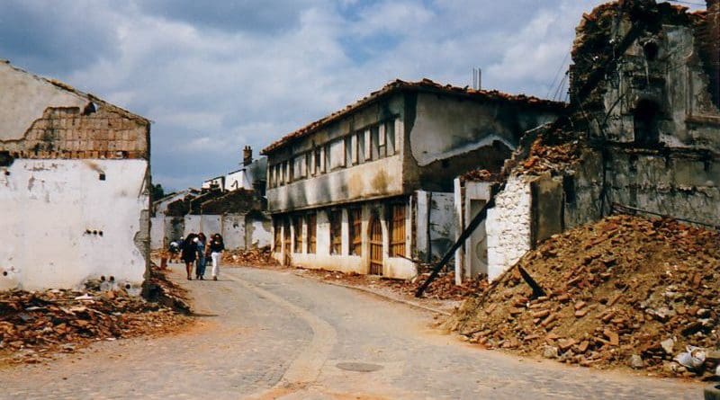 Streetscape of destroyed village during Kosovo War, 1999. Photo Credit: Marietta Amarcord, Wikipedia Commons
