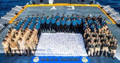 Members of HMCS CALGARY stand with 1286kg of heroin seized from a dhow during a counter-smuggling operation on 23 April, 2021 in the Arabian Sea during OPERATION ARTEMIS and as part of Combined Task Force 150. Please credit: Corporal Lynette Ai Dang, Her Majesty's Canadian Ship CALGARY, Imagery Technician ©2021 DND/MDN CANADA