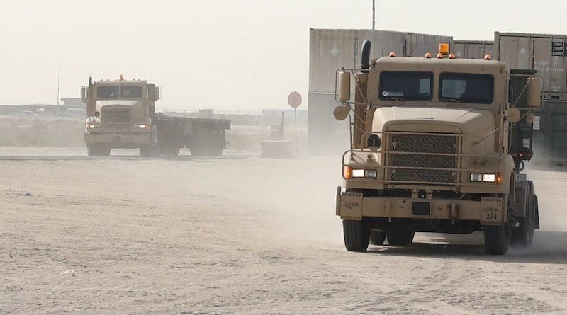 Tractor-trailer trucks arrive May 6, 2021, at the ammunition supply point at Camp Arifjan, Kuwait. They carry palletized bundles of munitions retrograded from Afghanistan. Photo Credit: Army Staff Sgt. Neil W. McCabe
