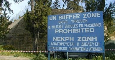"UN Buffer Zone" warning sign on the south (Greek) side of the Ledra Crossing of the Green Line in Nicosia, Cyprus. The other side of the fence is the Turkish side. Photo Credit: Jpatokal, Wikimedia Commons