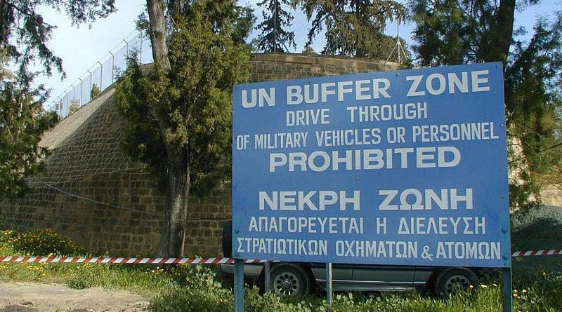 "UN Buffer Zone" warning sign on the south (Greek) side of the Ledra Crossing of the Green Line in Nicosia, Cyprus. The other side of the fence is the Turkish side. Photo Credit: Jpatokal, Wikimedia Commons