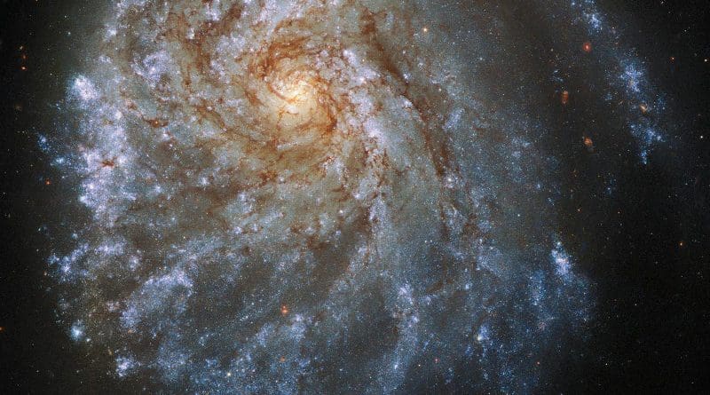 This spectacular image from the NASA/ESA Hubble Space Telescope shows the trailing arms of NGC 2276, a spiral galaxy 120 million light-years away in the constellation of Cepheus. At first glance, the delicate tracery of bright spiral arms and dark dust lanes resembles countless other spiral galaxies. A closer look reveals a strangely lopsided galaxy shaped by gravitational interaction and intense star formation. CREDIT ESA/Hubble & NASA, P. Sell Acknowledgement: L. Shatz