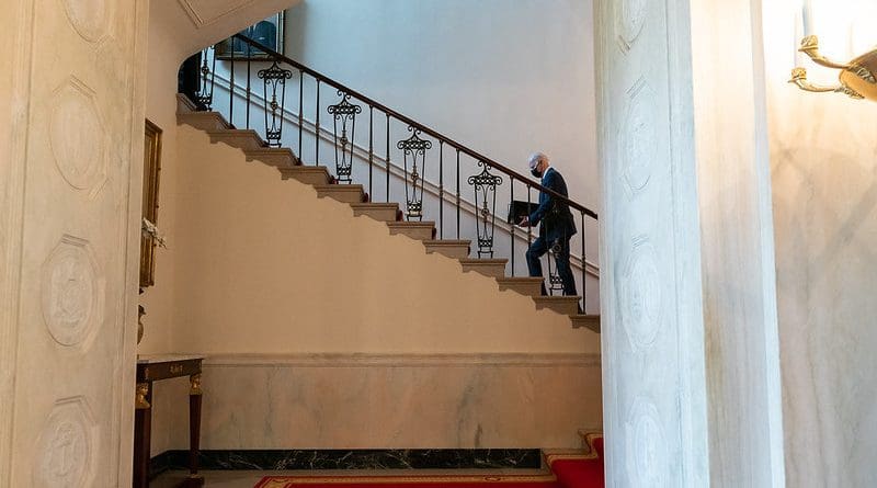 President Joe Biden walks up the Grand Staircase of the White House to the Second Floor private residence. (Official White House Photo by Adam Schultz)