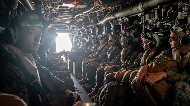 U.S. Marines and Australian service members sit aboard an Osprey en route to Darwin, Australia, after a site survey visit at Tiwi Island, Australia, in preparation for an upcoming exercise, May 3, 2021. Photo Credit: Marine Corps Master Sgt. Sarah Nadeau