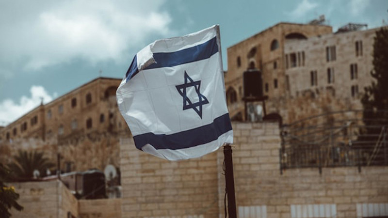 Israeli flag in Jerusalem. Photo: Taylor Brandon (@house_42), Unsplash