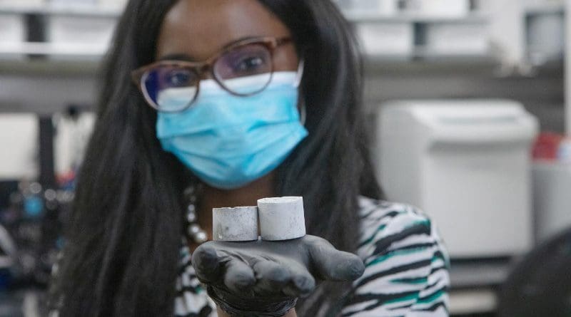 Professor Ange-Therese Akono holds a sample of her smart cement. CREDIT Northwestern University