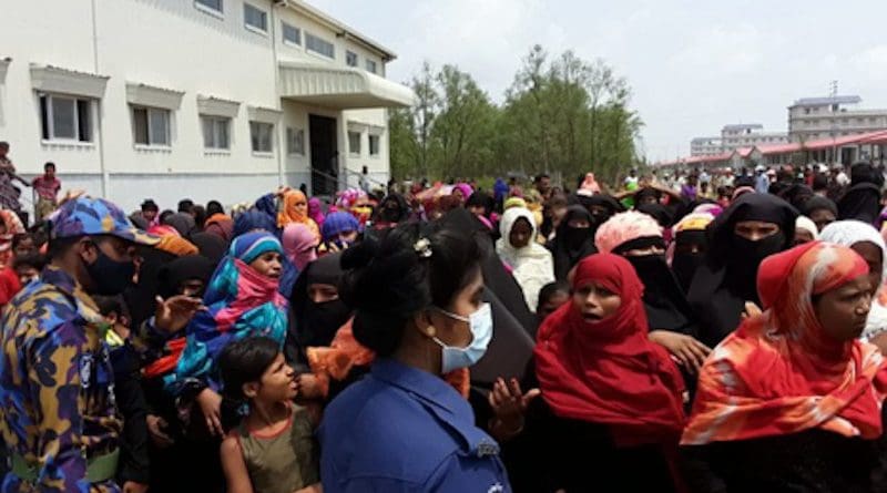 Rohingya refugees gather in an area of a complex housing at Bhashan Char in Bangladesh during a visit by senior officials of the United Nations refugee agency (UNHCR), May 31, 2021. (Source: BenarNews)