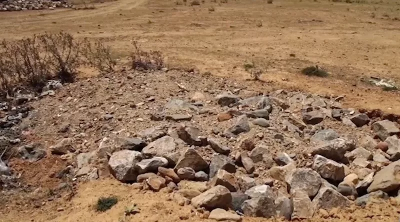 One of the numerous mass graves of civilian victims in Tigray, massacred by ENDF and allied forces. Photo Credit: VOA | Public domain.