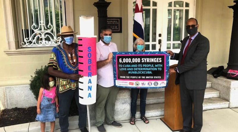 Rodney González, Chargé d’affaires at the Cuban Embassy, welcomes the donation of six million syringes. Photo Credit: COHA